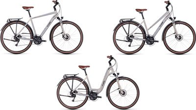 Drei Cube Touring Pro Fahrräder nebeneinander: eins mit Diamantrahmen, eins mit Trapezrahmen und eins als Tiefeinsteiger.